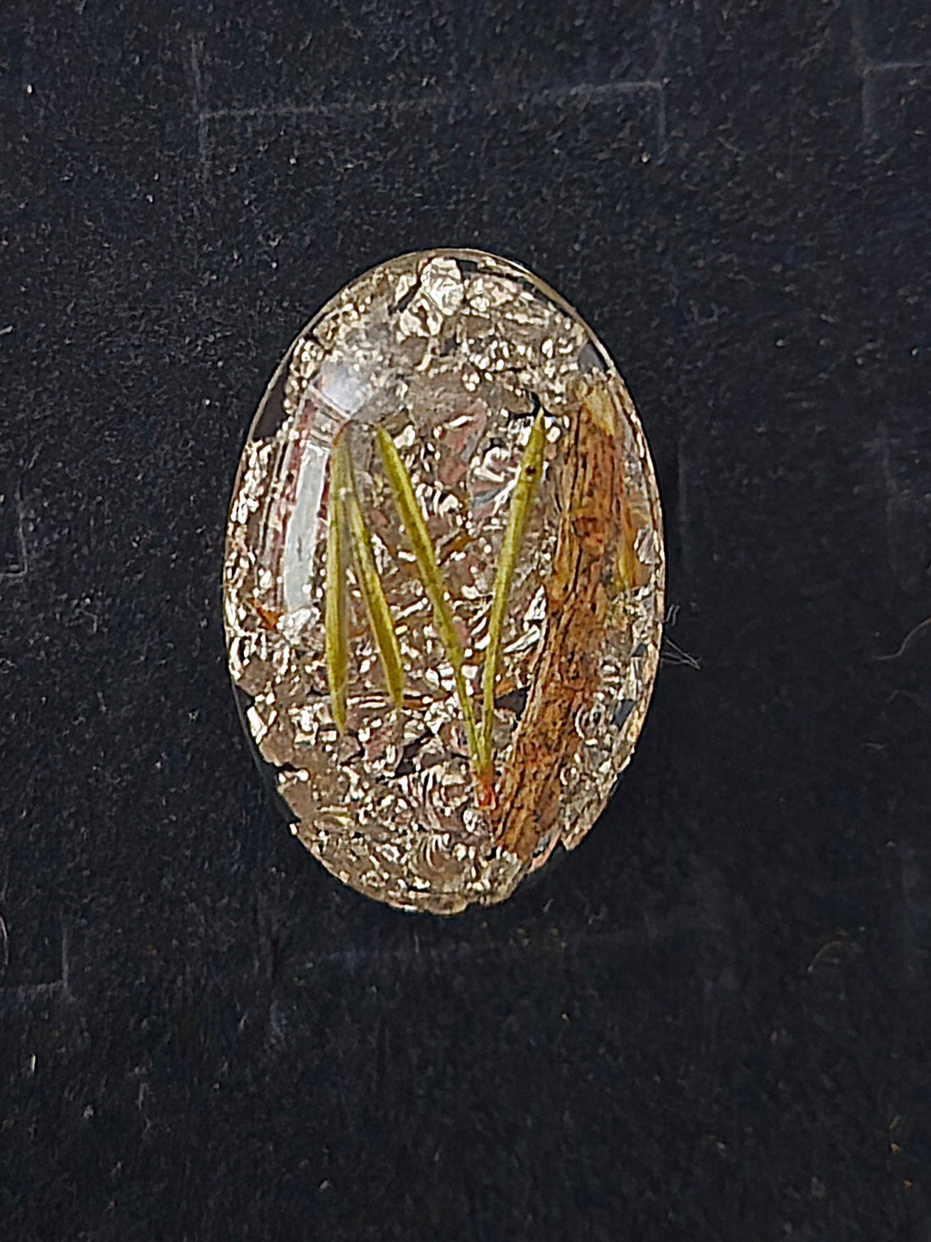 Ring med tallbarr och silverkross