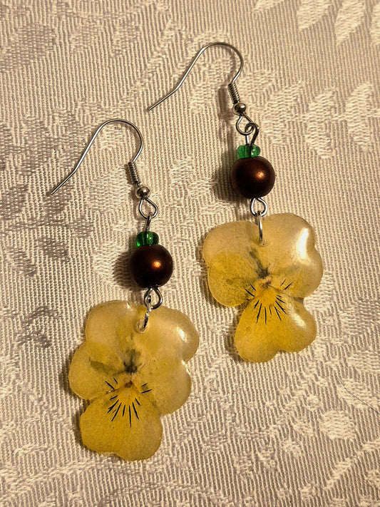 Earrings with dried pansies and recycled beads.